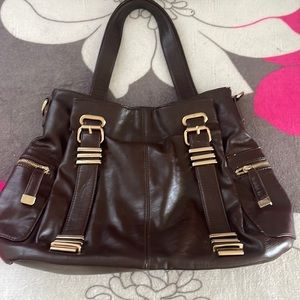 Charming Charlie Brown and gold purse